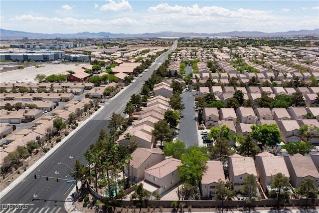 drone / aerial view with a residential view and a mountain view