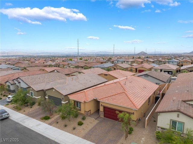 aerial view of residential area with mountains