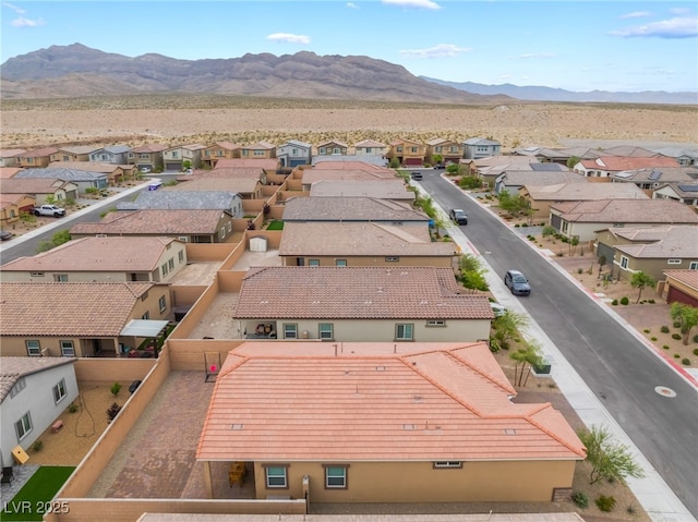 aerial perspective of suburban area featuring a mountainous background