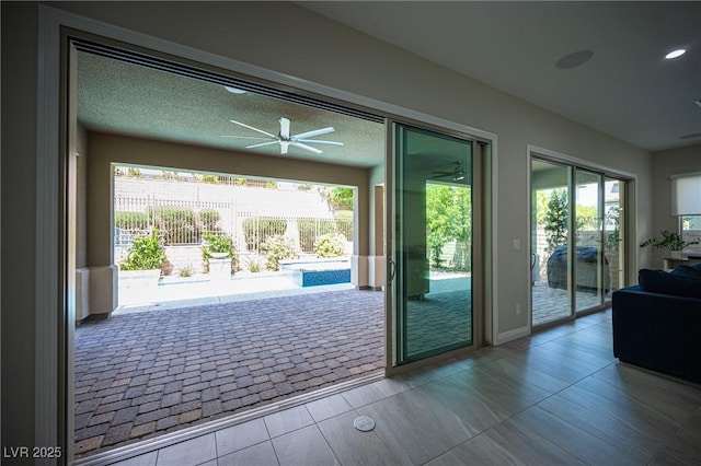 12018 Vento Forte Ave, Las Vegas, NV 89138 - doorway to outside with a ceiling fan and tile patterned floors