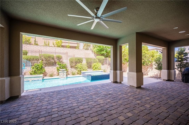 12018 Vento Forte Ave, Las Vegas, NV 89138 - view of patio featuring ceiling fan, a fenced backyard, and a pool with connected hot tub