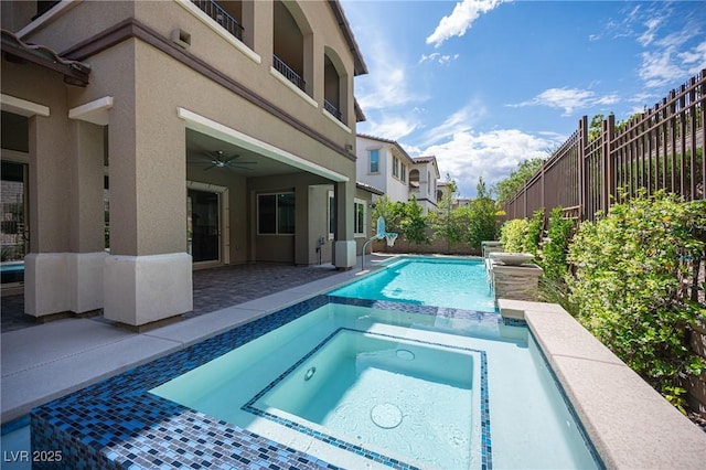 12018 Vento Forte Ave, Las Vegas, NV 89138 - view of pool featuring a fenced backyard, a patio area, a pool with connected hot tub, and a ceiling fan