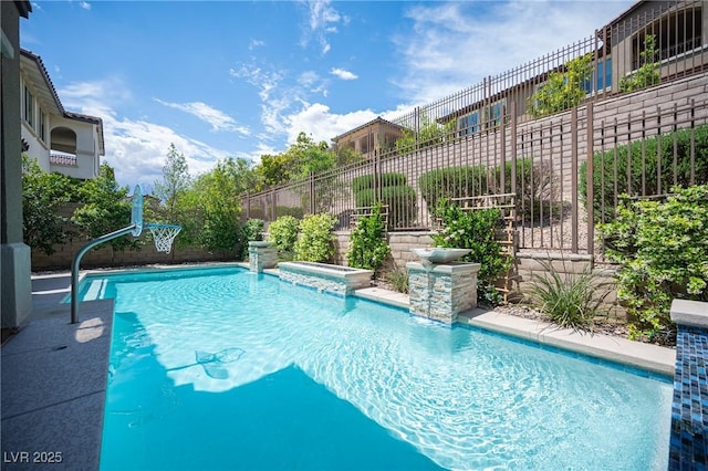 12018 Vento Forte Ave, Las Vegas, NV 89138 - view of swimming pool featuring fence and a pool with connected hot tub