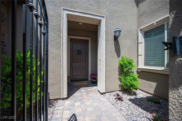 12018 Vento Forte Ave, Las Vegas, NV 89138 - view of exterior entry featuring stucco siding