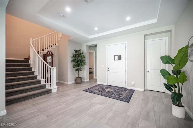 12018 Vento Forte Ave, Las Vegas, NV 89138 - foyer with a raised ceiling, stairway, baseboards, and recessed lighting