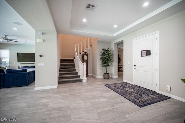 12018 Vento Forte Ave, Las Vegas, NV 89138 - foyer featuring stairway, ceiling fan, recessed lighting, baseboards, and a raised ceiling