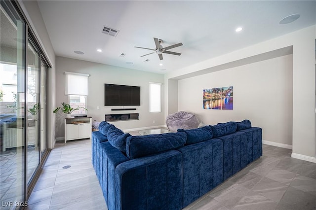 12018 Vento Forte Ave, Las Vegas, NV 89138 - living room featuring ceiling fan, healthy amount of natural light, recessed lighting, and baseboards