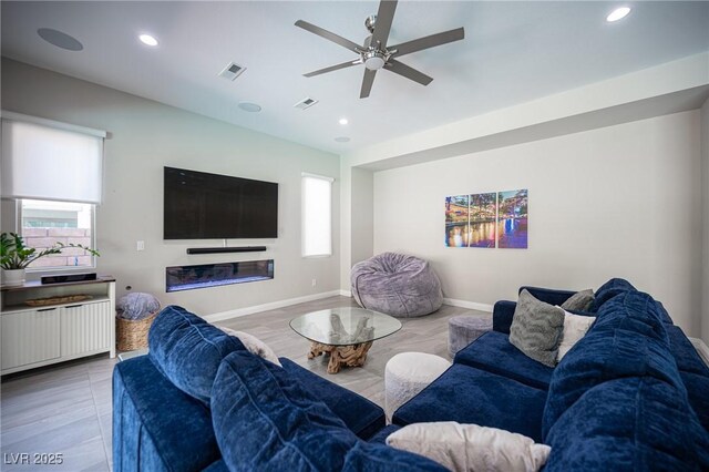 12018 Vento Forte Ave, Las Vegas, NV 89138 - living area with ceiling fan, recessed lighting, baseboards, and radiator