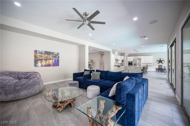 12018 Vento Forte Ave, Las Vegas, NV 89138 - living room with recessed lighting, ceiling fan, and baseboards