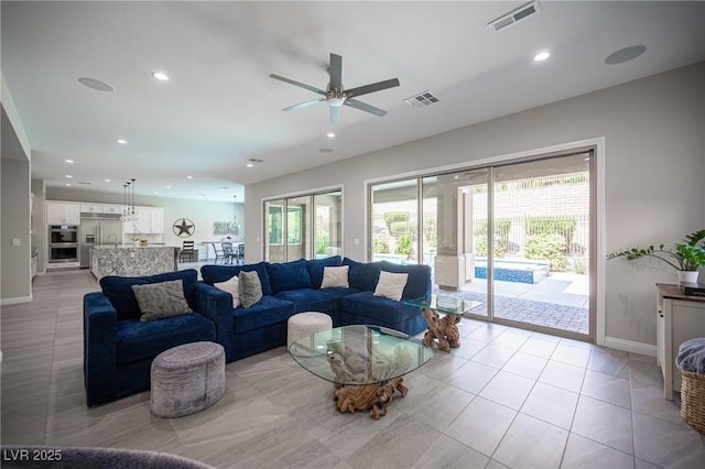 12018 Vento Forte Ave, Las Vegas, NV 89138 - living area featuring ceiling fan, baseboards, recessed lighting, and light tile patterned floors