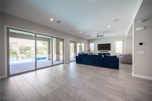 12018 Vento Forte Ave, Las Vegas, NV 89138 - living room with baseboards, a ceiling fan, recessed lighting, and light tile patterned flooring