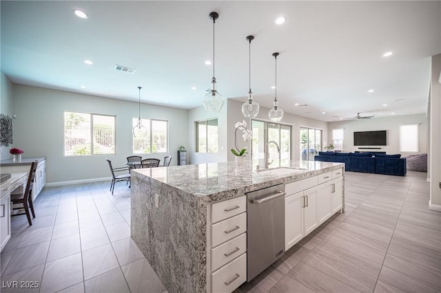 12018 Vento Forte Ave, Las Vegas, NV 89138 - kitchen with a sink, stainless steel dishwasher, recessed lighting, light tile patterned floors, and plenty of natural light