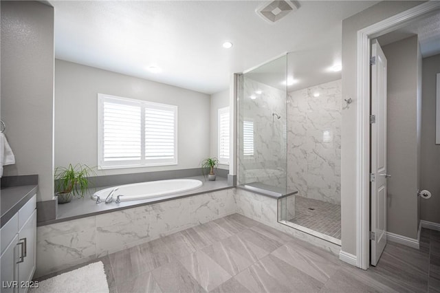 12018 Vento Forte Ave, Las Vegas, NV 89138 - bathroom with a marble finish shower, a bath, recessed lighting, and vanity