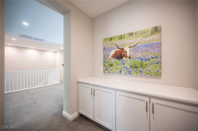 12018 Vento Forte Ave, Las Vegas, NV 89138 - corridor with dark colored carpet and recessed lighting