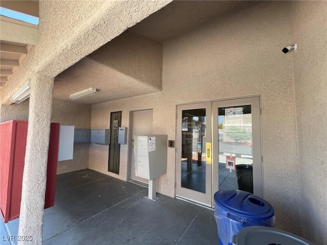 view of exterior entry featuring stucco siding