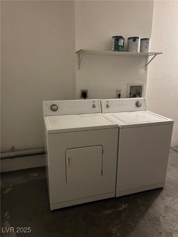 laundry room featuring washing machine and clothes dryer and laundry area