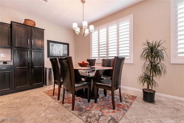63 Via Di Mello, Henderson, NV 89011 - dining area with a chandelier and baseboards