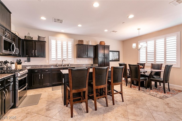 kitchen with visible vents, a sink, recessed lighting, and stainless steel appliances