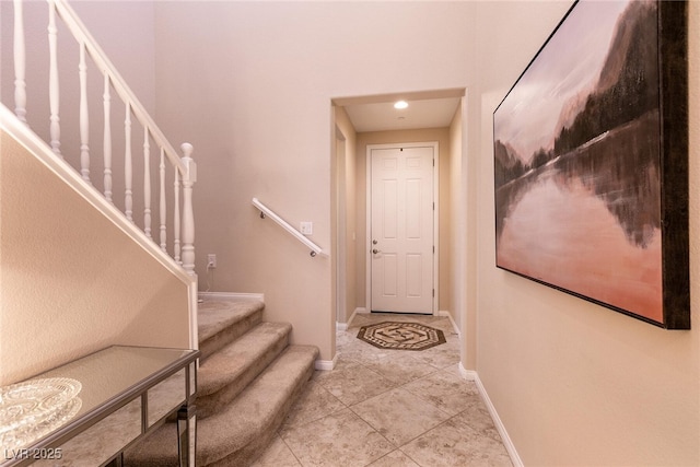 63 Via Di Mello, Henderson, NV 89011 - stairway featuring baseboards and tile patterned floors