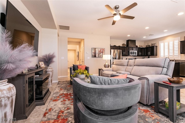 63 Via Di Mello, Henderson, NV 89011 - living area with ceiling fan, a fireplace, and recessed lighting