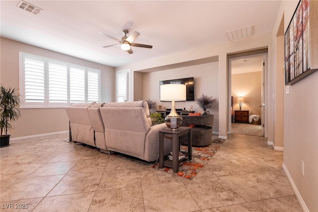63 Via Di Mello, Henderson, NV 89011 - living area with a ceiling fan and baseboards