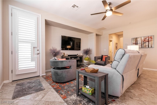63 Via Di Mello, Henderson, NV 89011 - living room featuring a ceiling fan and baseboards