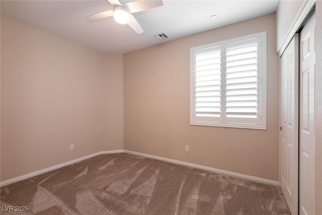 63 Via Di Mello, Henderson, NV 89011 - unfurnished bedroom featuring carpet floors, a closet, baseboards, and ceiling fan