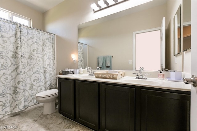 63 Via Di Mello, Henderson, NV 89011 - full bath with toilet, double vanity, tile patterned floors, and curtained shower