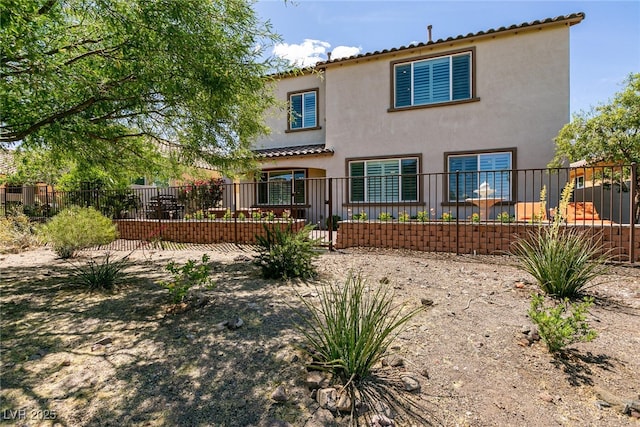 63 Via Di Mello, Henderson, NV 89011 - rear view of house featuring stucco siding