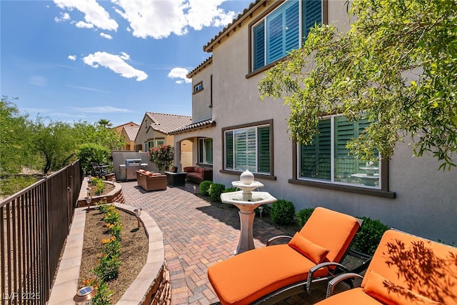 view of patio / terrace with an outdoor living space and fence private yard