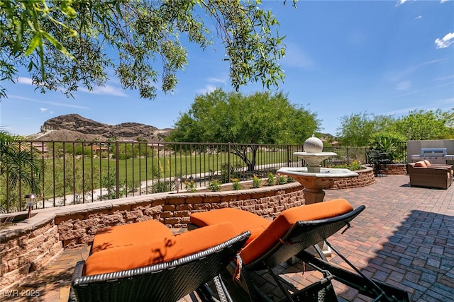 63 Via Di Mello, Henderson, NV 89011 - view of patio with a mountain view and fence