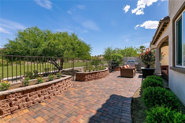 63 Via Di Mello, Henderson, NV 89011 - view of patio / terrace with an outdoor living space and a fenced backyard