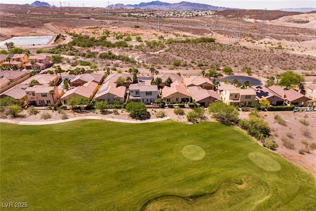 63 Via Di Mello, Henderson, NV 89011 - aerial view of residential area with a mountainous background, a desert landscape, and a golf club
