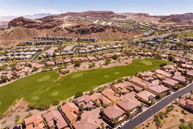 63 Via Di Mello, Henderson, NV 89011 - aerial view of property's location featuring nearby suburban area, a mountainous background, and a golf club