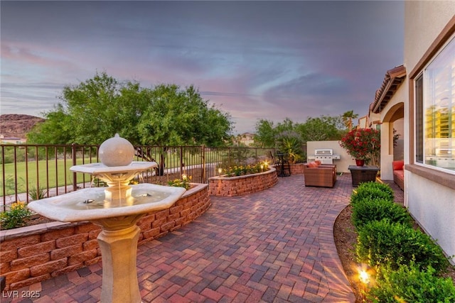 63 Via Di Mello, Henderson, NV 89011 - patio terrace at dusk featuring fence