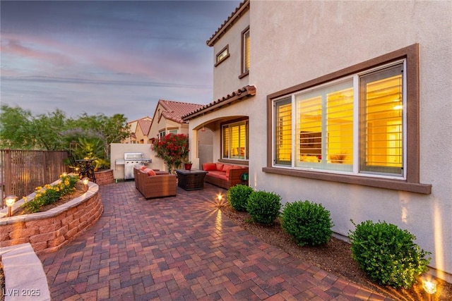 63 Via Di Mello, Henderson, NV 89011 - view of patio with an outdoor hangout area, fence, and area for grilling