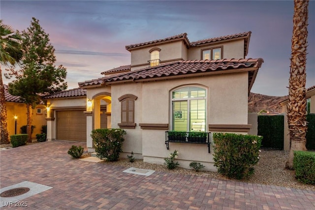 63 Via Di Mello, Henderson, NV 89011 - mediterranean / spanish house with a garage, stucco siding, and decorative driveway