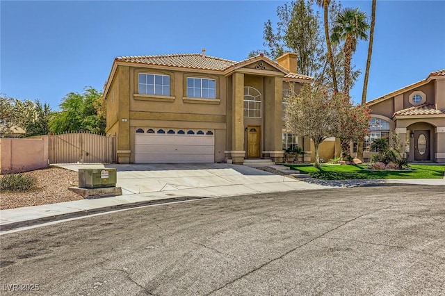 4 Bishopsgate Ter, Henderson, NV 89074 - view of front of home featuring a gate, an attached garage, driveway, a tile roof, and stucco siding