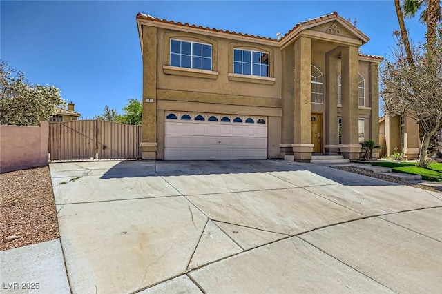 4 Bishopsgate Ter, Henderson, NV 89074 - view of front of property featuring driveway, stucco siding, an attached garage, a gate, and a tile roof