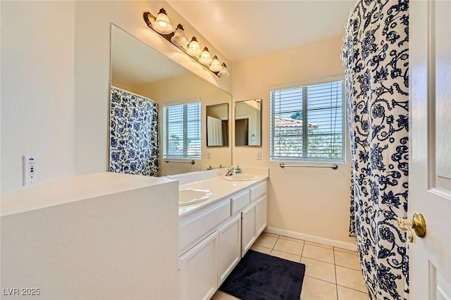 4 Bishopsgate Ter, Henderson, NV 89074 - bathroom with tile patterned floors, healthy amount of natural light, double vanity, and baseboards