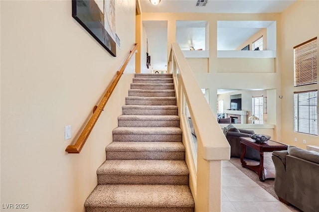 4 Bishopsgate Ter, Henderson, NV 89074 - staircase featuring tile patterned flooring and a fireplace