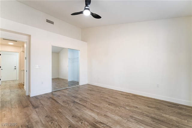 2505 Showcase Dr, Las Vegas, NV 89134 - unfurnished bedroom with wood finished floors, baseboards, a closet, and ceiling fan