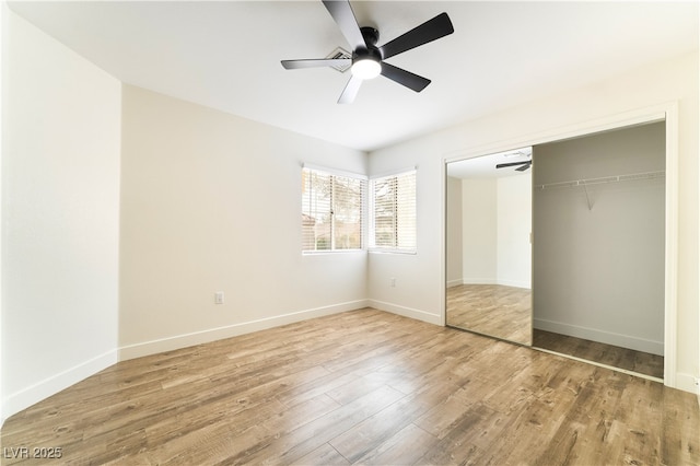 2505 Showcase Dr, Las Vegas, NV 89134 - unfurnished bedroom featuring light wood finished floors, a closet, baseboards, and a ceiling fan
