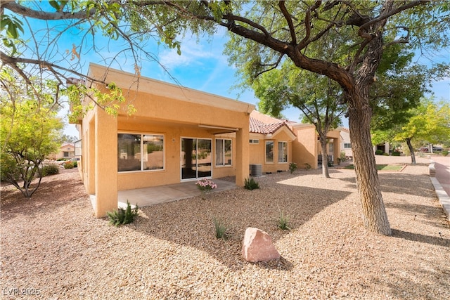 2505 Showcase Dr, Las Vegas, NV 89134 - rear view of property with stucco siding, a tile roof, a patio area, and central AC unit