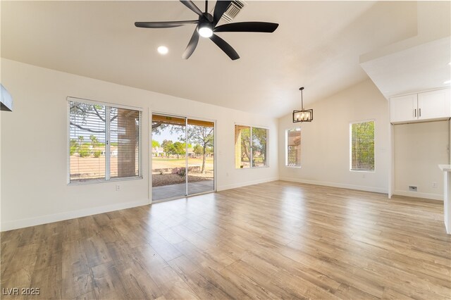 2505 Showcase Dr, Las Vegas, NV 89134 - unfurnished living room with vaulted ceiling, ceiling fan, light wood-style floors, and baseboards