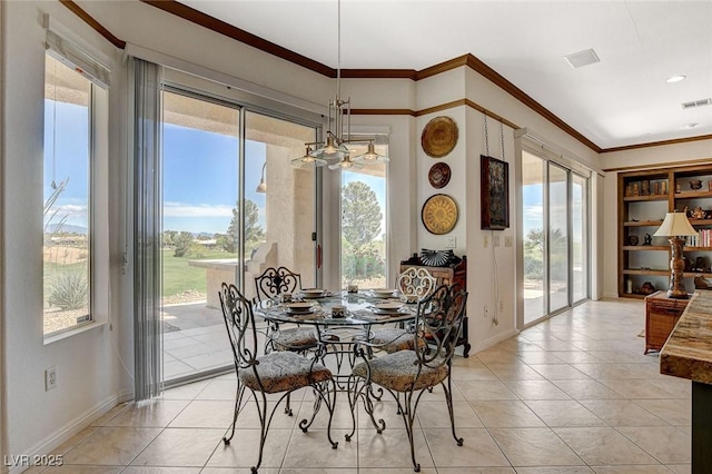 dining area with baseboards, crown molding, light tile patterned floors, and visible vents