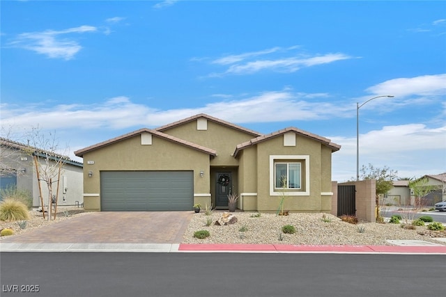 ranch-style home featuring a garage, stucco siding, and driveway