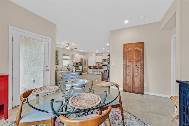 dining space featuring a ceiling fan, baseboards, recessed lighting, and light tile patterned floors