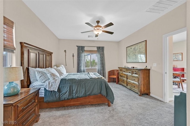 bedroom with baseboards, light carpet, a ceiling fan, and visible vents