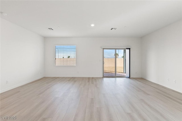 2733 Avril Point St, Las Vegas, NV 89156 - spare room with recessed lighting, visible vents, plenty of natural light, and light wood-style floors